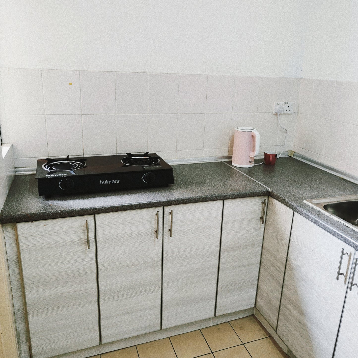 Kitchen cabinet views of a furnished 3 rooms house for rent at Aman Heights, Seri Kembangan