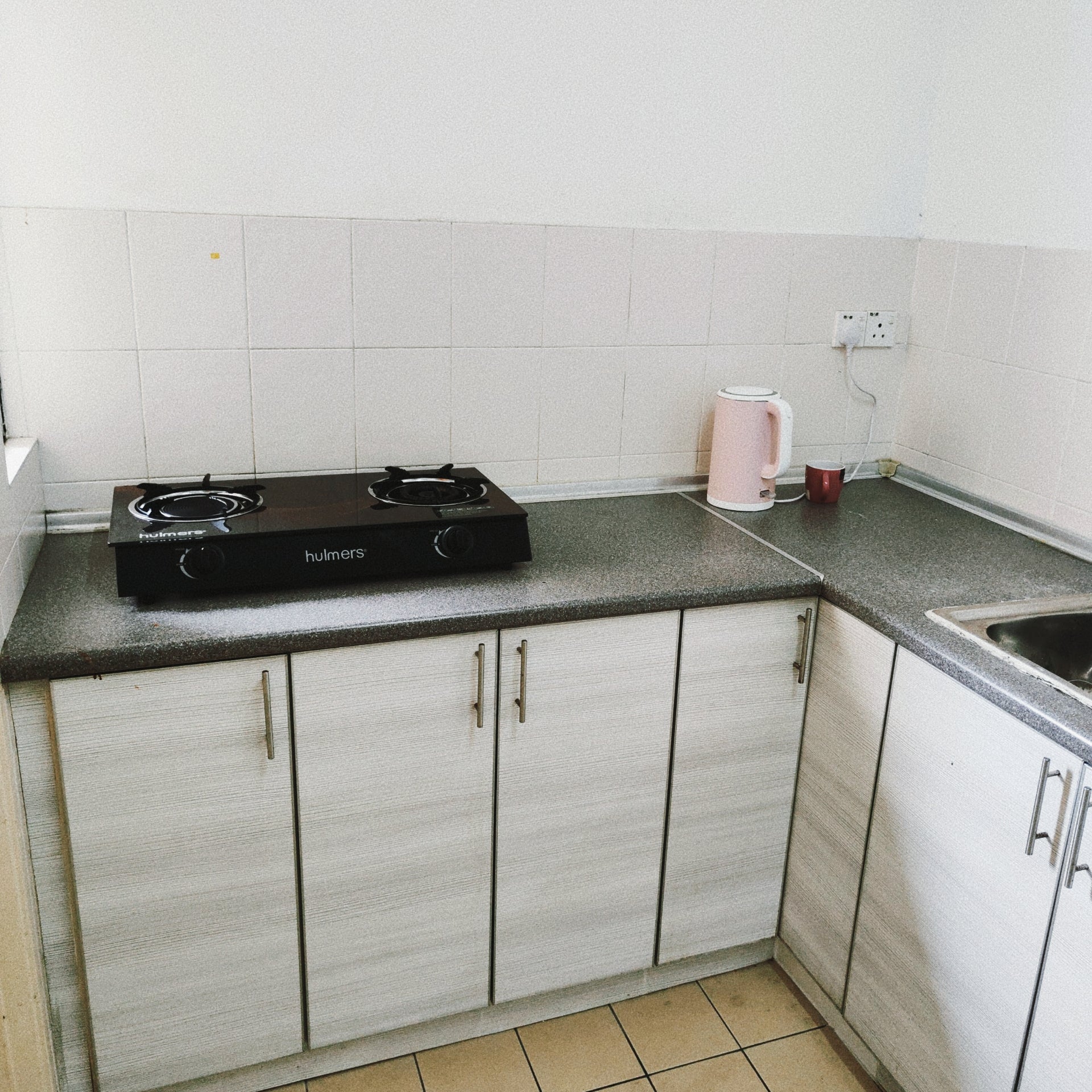 Kitchen cabinet views of a furnished 3 rooms house for rent at Aman Heights, Seri Kembangan