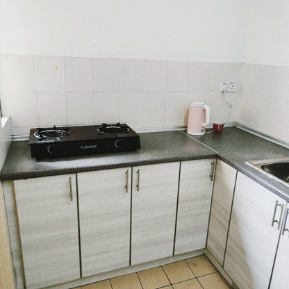 Kitchen cabinet views of a furnished 3 rooms house for rent at Aman Heights, Seri Kembangan