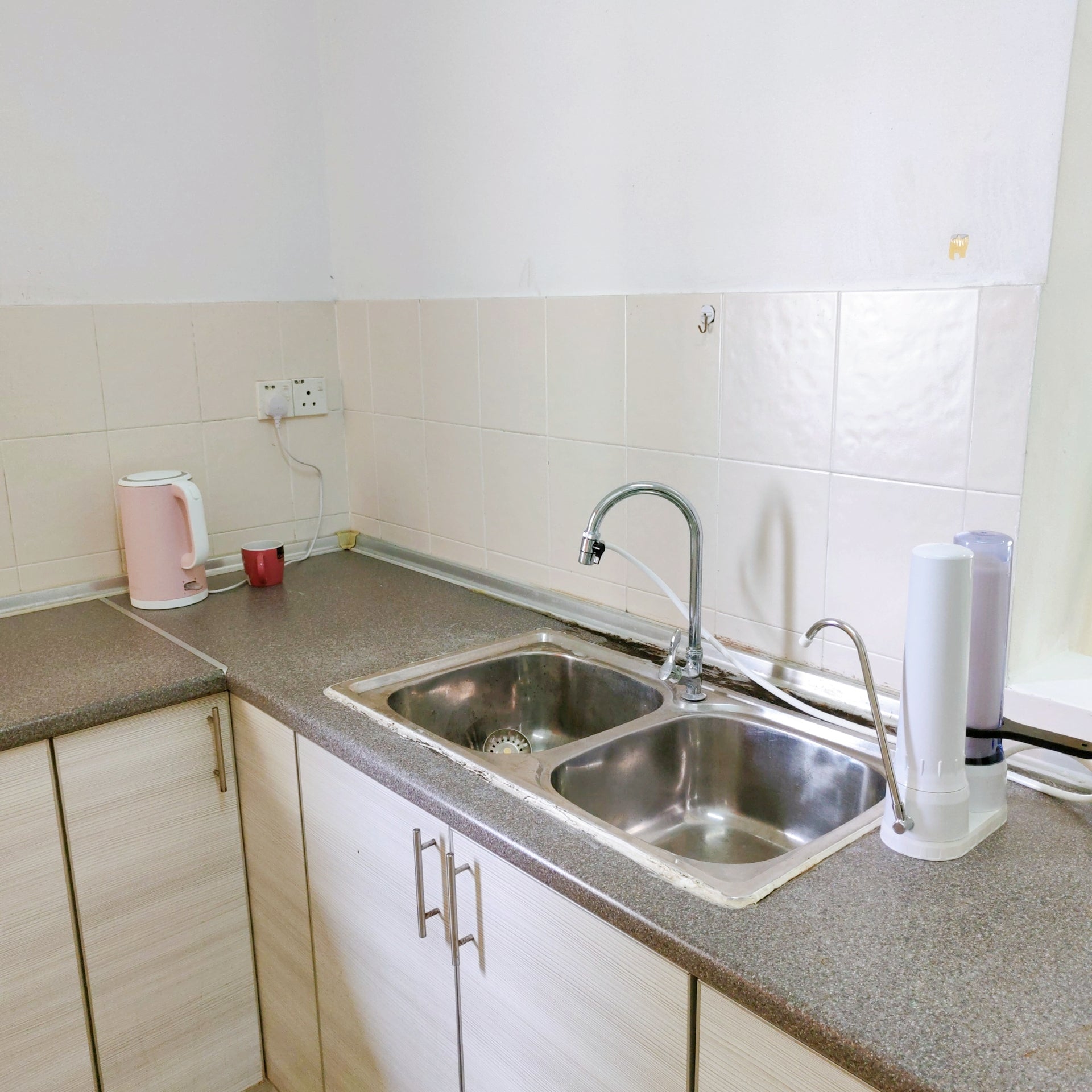 Kitchen cabinet area of a furnished 3 rooms house for rent at Aman Heights, Seri Kembangan