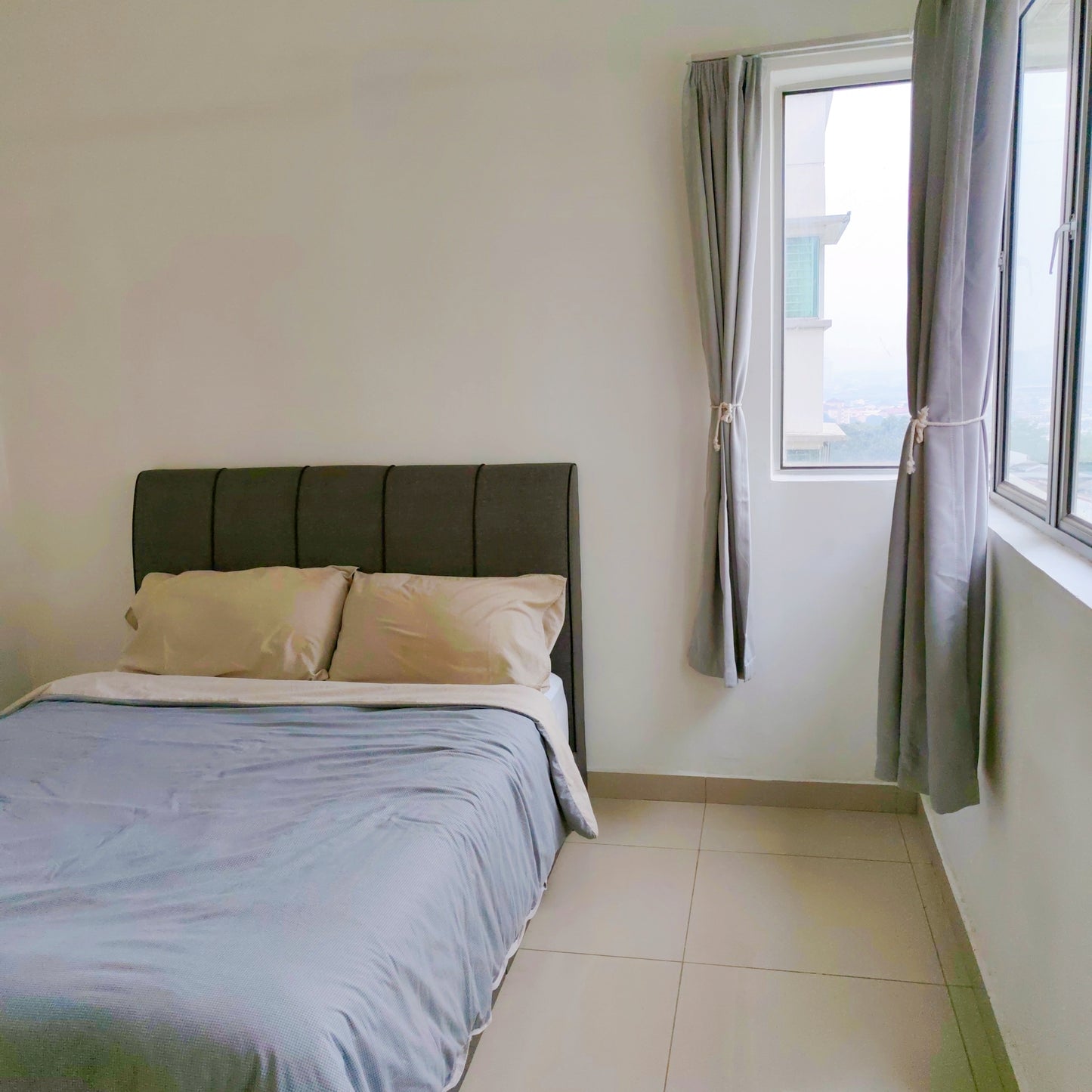 Queen bed in a master room of a house for rent at Aman Heights